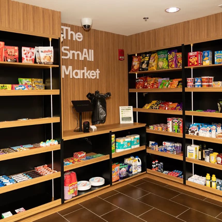 Inside The SmAll Market: a private 24/7 micro-market with snacks, groceries and a self-checkout kiosk inside a residential building